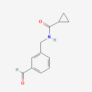 molecular formula C12H13NO2 B13199275 N-[(3-Formylphenyl)methyl]cyclopropanecarboxamide 