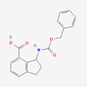 3-{[(benzyloxy)carbonyl]amino}-2,3-dihydro-1H-indene-4-carboxylic acid