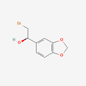 molecular formula C9H9BrO3 B13210954 (1R)-1-(2H-1,3-benzodioxol-5-yl)-2-bromoethan-1-ol 