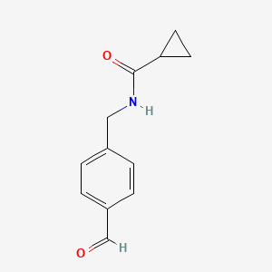 molecular formula C12H13NO2 B13212214 N-[(4-Formylphenyl)methyl]cyclopropanecarboxamide 