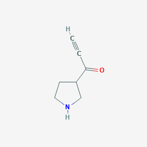 molecular formula C7H9NO B13220233 1-(Pyrrolidin-3-yl)prop-2-yn-1-one 