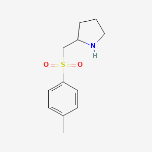 2-[(4-Methylbenzenesulfonyl)methyl]pyrrolidine