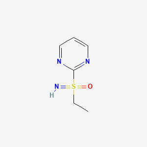 molecular formula C6H9N3OS B13239476 Ethyl(imino)(pyrimidin-2-yl)-lambda6-sulfanone 