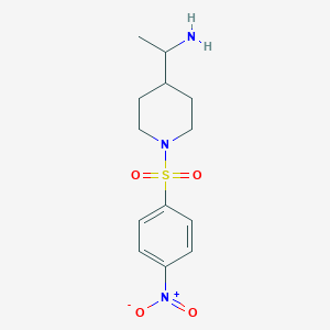 molecular formula C13H19N3O4S B13240572 1-[1-(4-Nitrobenzenesulfonyl)piperidin-4-yl]ethan-1-amine 