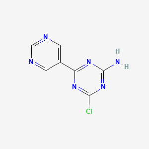 molecular formula C7H5ClN6 B13243595 4-Chloro-6-(pyrimidin-5-yl)-1,3,5-triazin-2-amine 