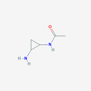 molecular formula C5H10N2O B13250361 N-(2-aminocyclopropyl)acetamide 