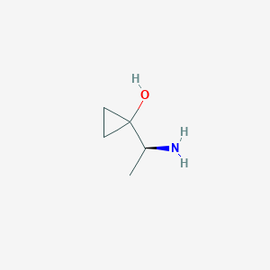 molecular formula C5H11NO B13255141 1-[(1S)-1-aminoethyl]cyclopropan-1-ol 