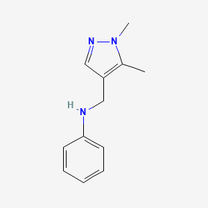 molecular formula C12H15N3 B13256574 N-[(1,5-Dimethyl-1H-pyrazol-4-yl)methyl]aniline 