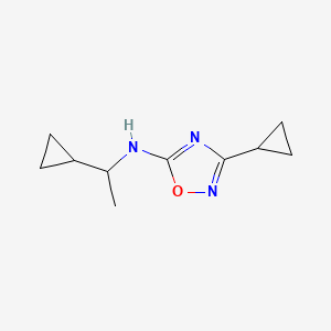 molecular formula C10H15N3O B13258845 3-Cyclopropyl-N-(1-cyclopropylethyl)-1,2,4-oxadiazol-5-amine 