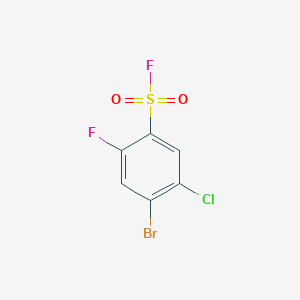 molecular formula C6H2BrClF2O2S B13270579 4-Bromo-5-chloro-2-fluorobenzene-1-sulfonyl fluoride 