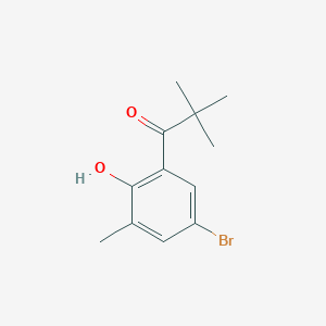 molecular formula C12H15BrO2 B13273950 1-(5-Bromo-2-hydroxy-3-methylphenyl)-2,2-dimethylpropan-1-one 