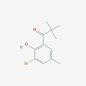 molecular formula C12H15BrO2 B13276666 1-(3-Bromo-2-hydroxy-5-methylphenyl)-2,2-dimethylpropan-1-one 