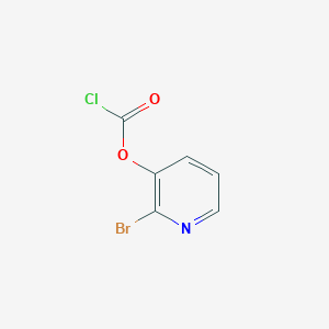 molecular formula C6H3BrClNO2 B13280937 Carbonochloridic acid, 2-bromo-3-pyridinyl ester 