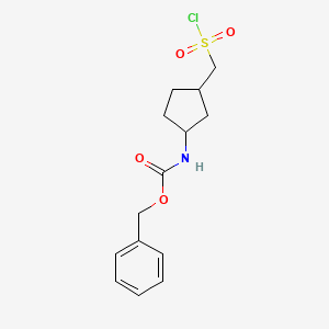 molecular formula C14H18ClNO4S B13286531 benzyl N-{3-[(chlorosulfonyl)methyl]cyclopentyl}carbamate 