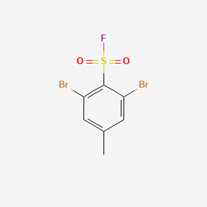 molecular formula C7H5Br2FO2S B13287691 2,6-Dibromo-4-methylbenzene-1-sulfonyl fluoride 