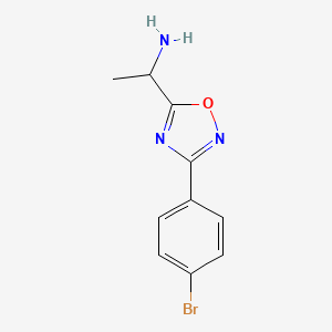 molecular formula C10H10BrN3O B13295501 1-[3-(4-Bromophenyl)-1,2,4-oxadiazol-5-yl]ethan-1-amine 