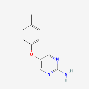 5-(4-Methylphenoxy)pyrimidin-2-amine