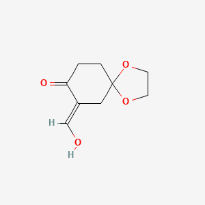 molecular formula C9H12O4 B13301757 (E)-7-(Hydroxymethylene)-1,4-dioxaspiro[4.5]decan-8-one 