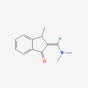 molecular formula C13H15NO B13303515 2-[(Dimethylamino)methylidene]-3-methyl-2,3-dihydro-1H-inden-1-one 