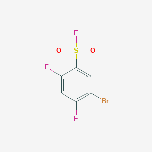 molecular formula C6H2BrF3O2S B13303662 5-Bromo-2,4-difluorobenzene-1-sulfonyl fluoride 