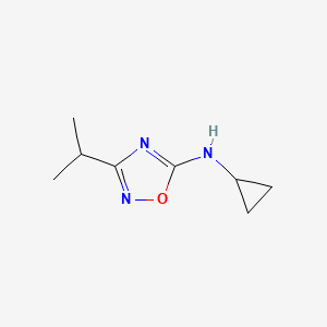 molecular formula C8H13N3O B13304846 Cyclopropyl-(3-isopropyl-[1,2,4]oxadiazol-5-YL)-amine 