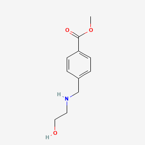 molecular formula C11H15NO3 B13305053 Methyl 4-{[(2-hydroxyethyl)amino]methyl}benzoate 