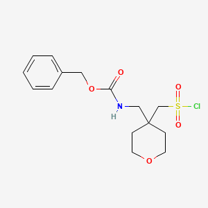 molecular formula C15H20ClNO5S B13305783 Benzyl N-({4-[(chlorosulfonyl)methyl]oxan-4-yl}methyl)carbamate 