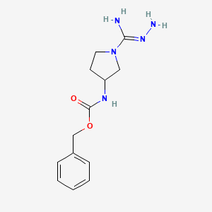 molecular formula C13H19N5O2 B13307356 Benzyl N-[1-(N'-aminocarbamimidoyl)pyrrolidin-3-yl]carbamate 