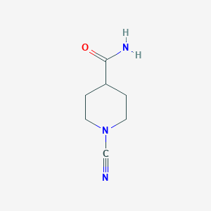 molecular formula C7H11N3O B13310527 1-Cyanopiperidine-4-carboxamide 