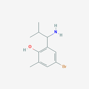 molecular formula C11H16BrNO B13312323 2-(1-Amino-2-methylpropyl)-4-bromo-6-methylphenol 