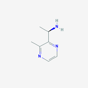 molecular formula C7H11N3 B13314186 (1R)-1-(3-Methylpyrazin-2-yl)ethan-1-amine 