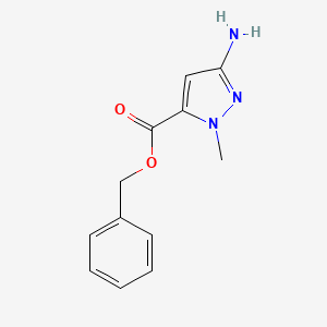 molecular formula C12H13N3O2 B13315225 Benzyl 3-amino-1-methyl-1H-pyrazole-5-carboxylate 