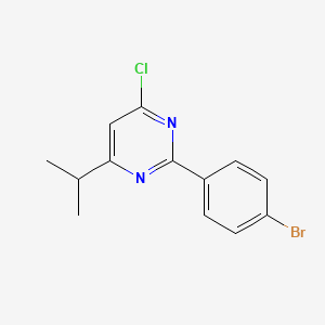 molecular formula C13H12BrClN2 B13316859 2-(4-Bromophenyl)-4-chloro-6-(propan-2-YL)pyrimidine 