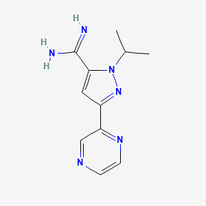 molecular formula C11H14N6 B13328175 1-isopropyl-3-(pyrazin-2-yl)-1H-pyrazole-5-carboximidamide 