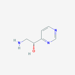 (1R)-2-Amino-1-(pyrimidin-4-yl)ethan-1-ol