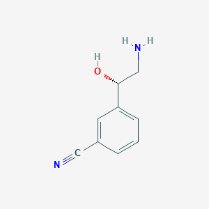 molecular formula C9H10N2O B13340816 3-[(1S)-2-Amino-1-hydroxyethyl]benzonitrile 