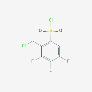 molecular formula C7H3Cl2F3O2S B13342509 2-(Chloromethyl)-3,4,5-trifluorobenzene-1-sulfonyl chloride 