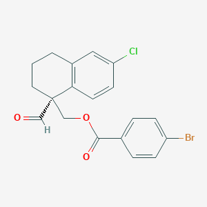 molecular formula C19H16BrClO3 B13357485 (R)-(6-chloro-1-formyl-1,2,3,4-tetrahydronaphthalen-1-yl)methyl 4-bromobenzoate 