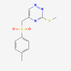 molecular formula C12H13N3O2S2 B13361503 5-{[(4-Methylphenyl)sulfonyl]methyl}-3-(methylsulfanyl)-1,2,4-triazine 