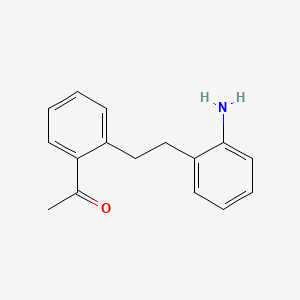 molecular formula C16H17NO B13365506 1-{2-[2-(2-Aminophenyl)ethyl]phenyl}ethanone 