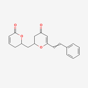 molecular formula C19H18O4 B13391285 2-[(6-Oxo-2,3-dihydropyran-2-yl)methyl]-6-(2-phenylethenyl)-2,3-dihydropyran-4-one 