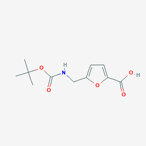 molecular formula C11H15NO5 B1343870 5-{[(Tert-butoxycarbonyl)amino]methyl}-2-furoic acid CAS No. 160938-85-2
