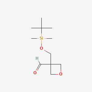 3-{[(Tert-butyldimethylsilyl)oxy]methyl}oxetane-3-carbaldehyde