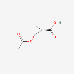 molecular formula C6H8O4 B13455326 rac-(1R,2R)-2-(acetyloxy)cyclopropane-1-carboxylicacid 