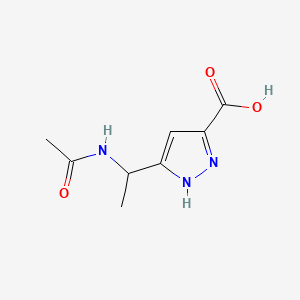 molecular formula C8H11N3O3 B13467397 5-(1-acetamidoethyl)-1H-pyrazole-3-carboxylic acid 