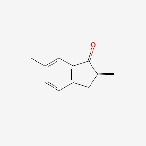 molecular formula C11H12O B13470842 (2S)-2,6-dimethyl-2,3-dihydro-1H-inden-1-one 