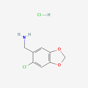 molecular formula C8H9Cl2NO2 B13474012 1-(6-Chloro-1,3-dioxaindan-5-yl)methanamine hydrochloride 