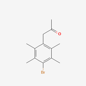 molecular formula C13H17BrO B13478167 1-(4-Bromo-2,3,5,6-tetramethylphenyl)propan-2-one 