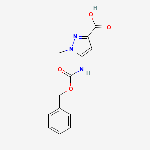 molecular formula C13H13N3O4 B13482635 5-(Benzyloxycarbonylamino)-1-methylpyrazole-3-carboxylic acid 