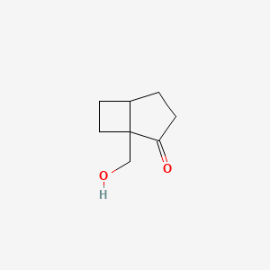 molecular formula C8H12O2 B13487610 1-(Hydroxymethyl)bicyclo[3.2.0]heptan-2-one 